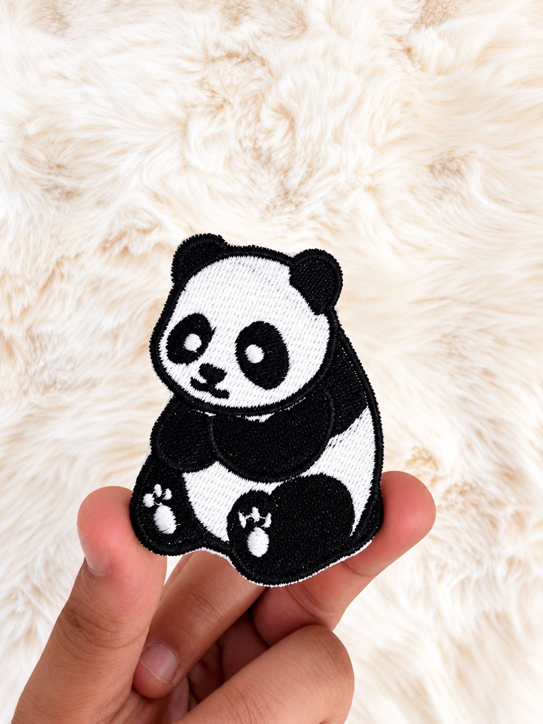 Panda velcro patch, in hand