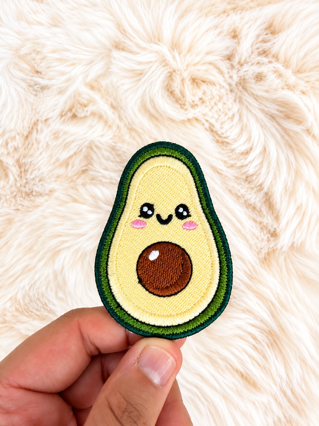 Avocado velcro patch, in hand